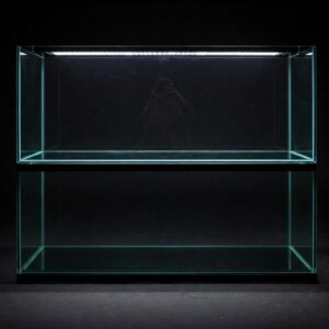 A 120 gallon fish tank filled with colorful tropical fish and decorative coral structures.