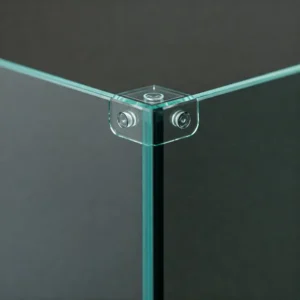 Detailed view of the smooth, bonded glass edges of a rimless fish tank, highlighting its elegant construction.