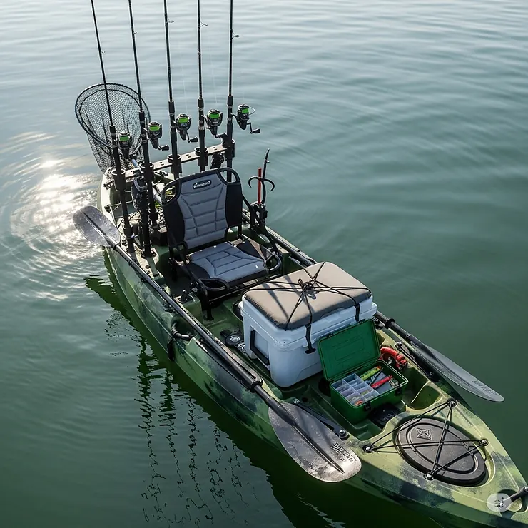 An overhead view of a fully rigged fishing kayak with a kayak rod rack, cooler, and tackle box.