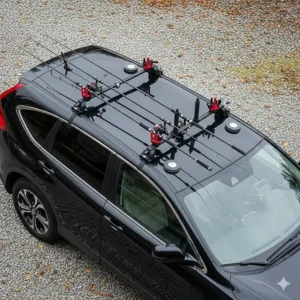 An overhead view of a car with a temporary, magnetic fishing rod car rack attached to the roof, showing its non-permanent installation.