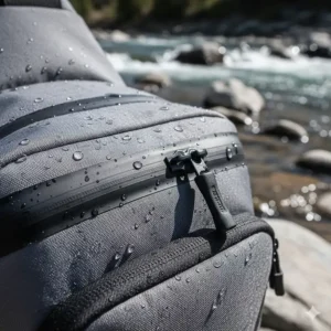 Close-up of TPU coated fabric and waterproof zippers on a fly fishing sling pack.
