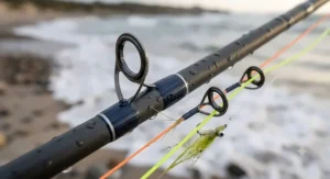 Close-up view of corrosion-resistant guides on a fast action 8 weight fly rod for saltwater fishing.