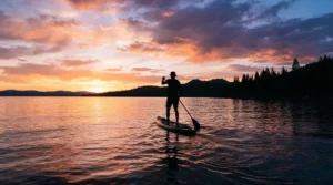 Paddling back at dusk in specialized fishing pants with knee pads for kayak fishing.